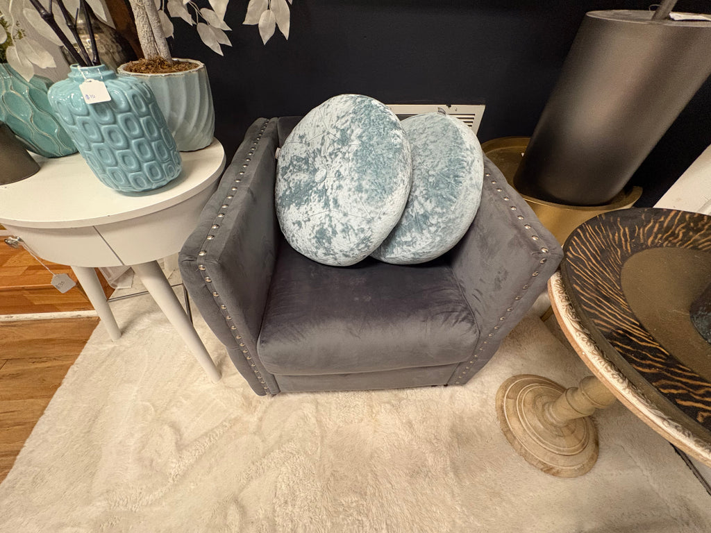 grey velvet tufted accent chair with nailhead trim and wooden feet.