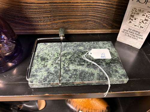green marble cheese and butter slicer with a stainless steel wire cutter and matching stone handle